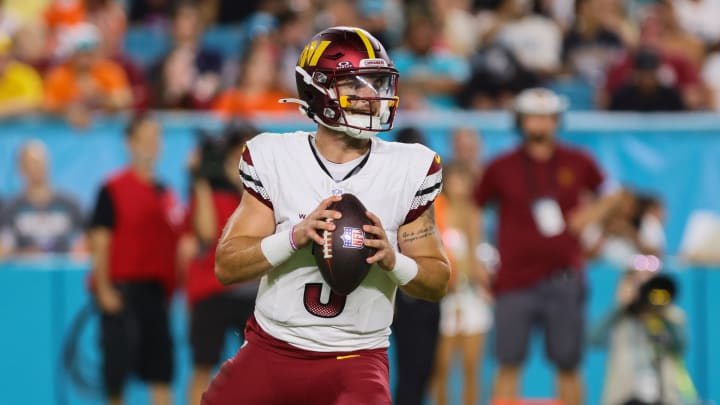 Aug 17, 2024; Miami Gardens, Florida, USA; Washington Commanders quarterback Trace McSorley (3) looks for passing option against the Miami Dolphins during the third quarter of a preseason game at Hard Rock Stadium. Mandatory Credit: Sam Navarro-USA TODAY Sports