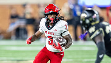 Sep 11, 2025; Winston-Salem, North Carolina, USA;  North Carolina State Wolfpack running back Hollywood Smothers (3) runs the ball in the first half against the Wake Forest Demon Deacons at Allegacy Federal Credit Union Stadium. Mandatory Credit: Luke Jamroz-Imagn Images
