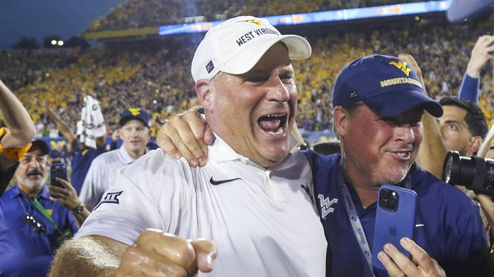 Sep 13, 2025; Morgantown, West Virginia, USA; West Virginia Mountaineers head coach Rich Rodriguez celebrates after defeating the Pittsburgh Panthers at Milan Puskar Stadium. Mandatory Credit: Ben Queen-Imagn Images