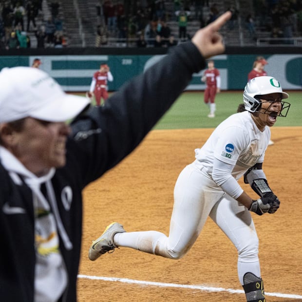 Oregon’s Dezianna Patmon heads for home after hitting a game winning home run against Stanford.