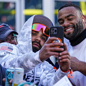 NFL defensive end Solomon Thomas takes a selfie with a fan before the start of the game against the New England Patriots 