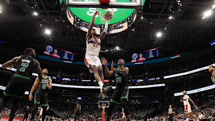 Oct 24, 2024; Washington, District of Columbia, USA; Washington Wizards forward Alex Sarr (20) dunks the ball as Boston Celtics center Al Horford (42) looks on in the first half at Capital One Arena. Mandatory Credit: Geoff Burke-Imagn Images
