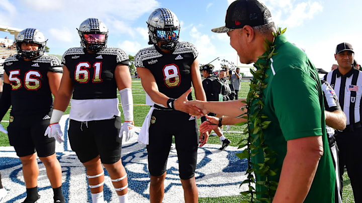 Jan 20, 2023; Honolulu, Hawaii, US; NFL retiree Jesse Sapolu shock hands with Team Mauka quarterback from Warren high school Nicholaus Iamaleava (8) prior to the coin toss of the Polynesian Bowl at Kunuiakea Stadium. Mandatory Credit: Steven Erler-USA TODAY NETWORK Jan 20, 2023; Honolulu, Hawaii, US; NFL retiree Jesse Sapolu shock hands with Team Mauka quarterback from Warren high school Nicholaus Iamaleava (8) prior to the coin toss of the Polynesian Bowl at Kunuiakea Stadium. Mandatory Credit: Steven Erler-USA TODAY NETWORK