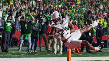 Oct 18, 2025; Piscataway, New Jersey, USA;  Oregon Ducks tight end Kenyon Sadiq (18) catches a touchdown pass during the first half against the Rutgers Scarlet Knights at SHI Stadium. Mandatory Credit: Vincent Carchietta-Imagn Images