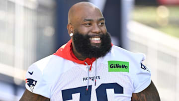 Jul 23, 2025; Foxborough, MA, USA; New England Patriots offensive tackle Morgan Moses (76) walks to the practice field for training camp at Gillette Stadium. Mandatory Credit: Eric Canha-Imagn Images