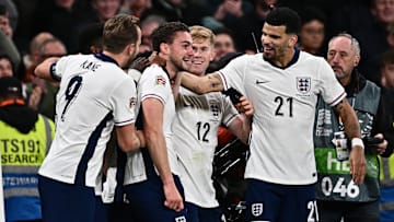 Dominic Solanke congratulates Taylor Harwood-Bellis along with Lewis Hall and Harry Kane 