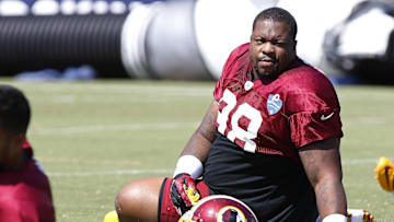Aug 1, 2015; Richmond, VA, USA; Washington Redskins defensive tackle Terrance Knighton (98) stretches on the field during afternoon practice as part of day three of training camp at Bon Secours Washington Redskins Training Center. Mandatory Credit: Geoff Burke-Imagn Images