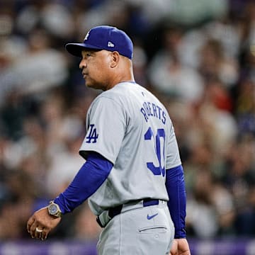 Sep 27, 2024; Denver, Colorado, USA; Los Angeles Dodgers manager Dave Roberts (30) walks to the mound in the seventh inning against the Colorado Rockies at Coors Field. Mandatory Credit: Isaiah J. Downing-Imagn Images
