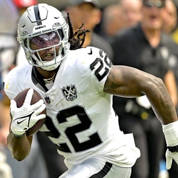 Sep 8, 2024; Inglewood, California, USA; Las Vegas Raiders running back Alexander Mattison (22) runs for a touchdown in the first half against the Los Angeles Chargers at SoFi Stadium.