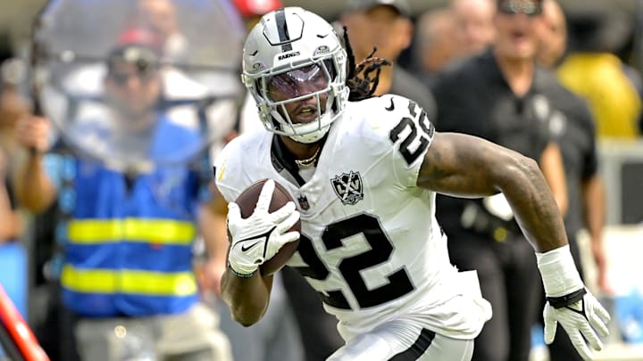 Sep 8, 2024; Inglewood, California, USA; Las Vegas Raiders running back Alexander Mattison (22) runs for a touchdown in the first half against the Los Angeles Chargers at SoFi Stadium.