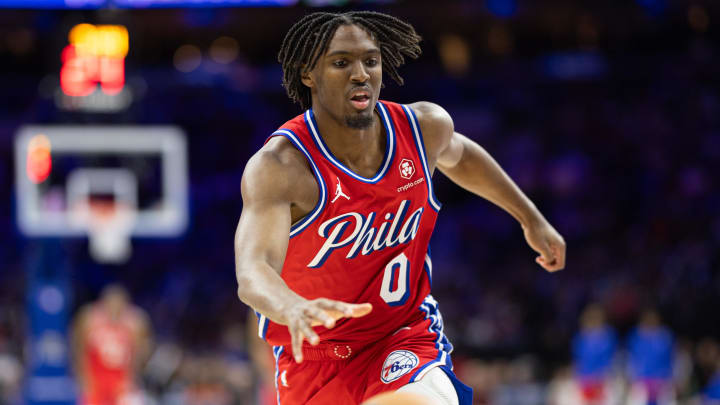 Apr 12, 2024; Philadelphia, Pennsylvania, USA; Philadelphia 76ers guard Tyrese Maxey (0) chases a loose ball against the Orlando Magic during the third quarter at Wells Fargo Center. Mandatory Credit: Bill Streicher-USA TODAY Sports