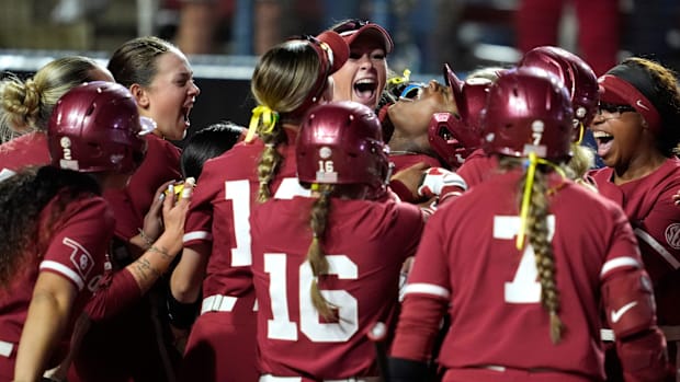 Oklahoma's Maya Bland (12) celebrates after hitting a three-run home run in the fourth inning.
