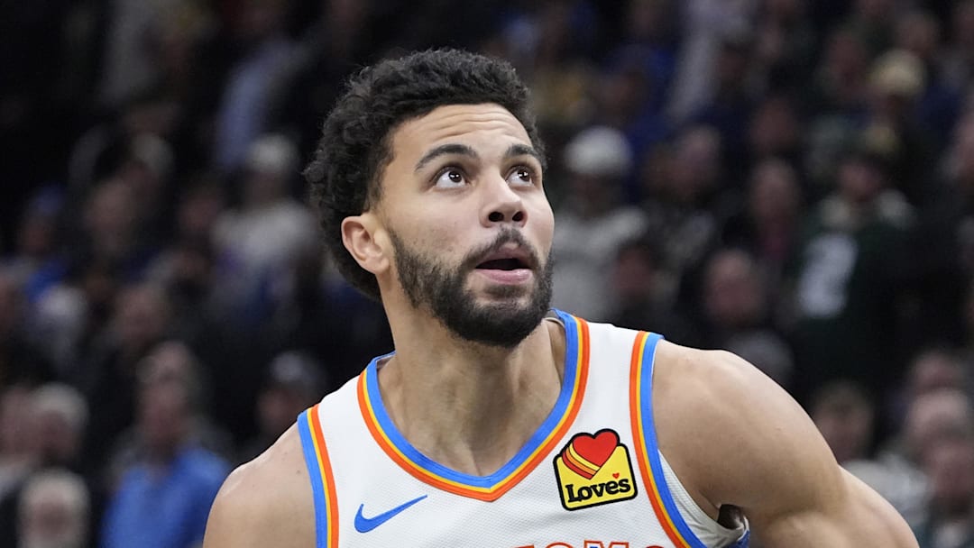 Jan 21, 2026; Milwaukee, Wisconsin, USA; Oklahoma City Thunder guard Ajay Mitchell (25) goest up for shot after stealing the ball from he Milwaukee Bucks at Fiserv Forum. Mandatory Credit: Michael McLoone-Imagn Images