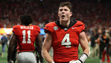 Dec 7, 2024; Atlanta, GA, USA; Georgia Bulldogs tight end Oscar Delp (4) reacts after defeating the Texas Longhorns in overtime in the 2024 SEC Championship game at Mercedes-Benz Stadium. Mandatory Credit: Brett Davis-Imagn Images