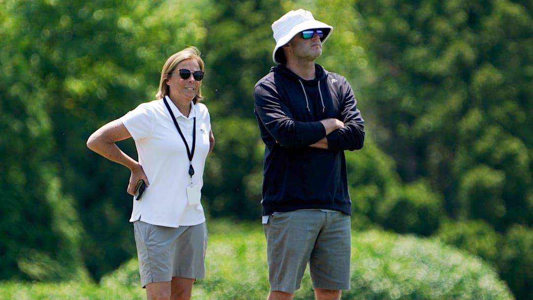 Katie Blackburn, left, and Duke Tobin, right, watch the Cincinnati Bengals practice, Wednesday, June 11, 2025, at Kettering Health Practice Fields in Downtown Cincinnati.