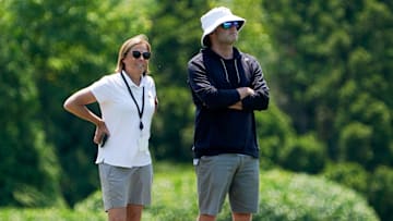 Katie Blackburn, left, and Duke Tobin, right, watch the Cincinnati Bengals practice, Wednesday, June 11, 2025, at Kettering Health Practice Fields in Downtown Cincinnati.
