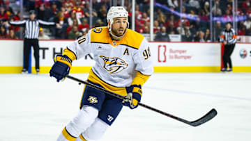 Jan 4, 2025; Calgary, Alberta, CAN; Nashville Predators center Ryan O'Reilly (90) skates against the Calgary Flames during the third period at Scotiabank Saddledome. Mandatory Credit: Sergei Belski-Imagn Images