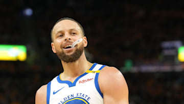 Golden State Warriors guard Stephen Curry stands on the court against the Houston Rockets.