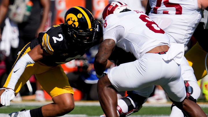 Iowa Hawkeyes defensive back TJ Hall (2) tackles Indiana Hoosiers running back Kaelon Black (8) Sept. 27, 2025 at Kinnick Stadium in Iowa City, Iowa.