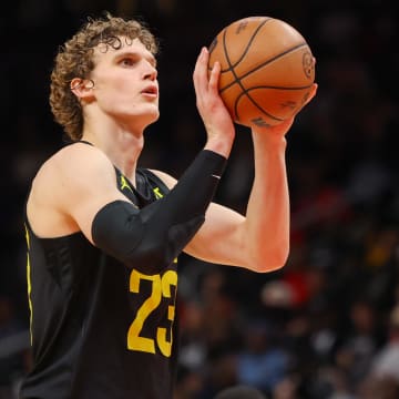 Utah Jazz forward Lauri Markkanen (23) shoots a free throw against the Atlanta Hawks in the second half at State Farm Arena. Mandatory Credit: