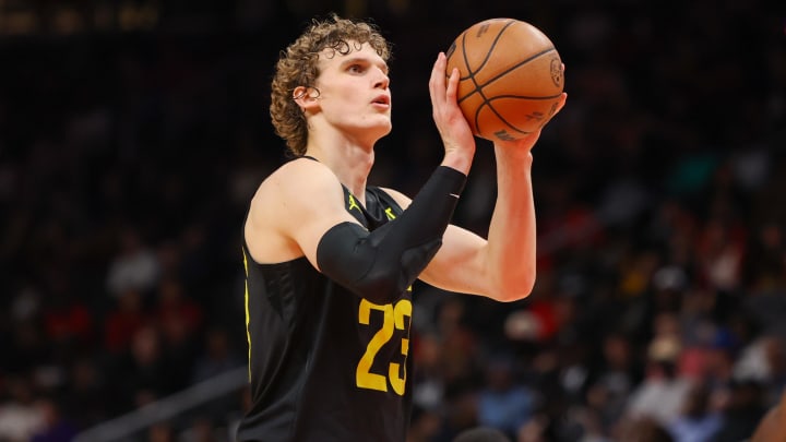 Utah Jazz forward Lauri Markkanen (23) shoots a free throw against the Atlanta Hawks in the second half at State Farm Arena. Mandatory Credit: