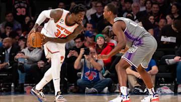 Dec 11, 2022; New York, New York, USA; New York Knicks forward Julius Randle (30) is defended by Sacramento Kings forward Harrison Barnes (40) during the second quarter at Madison Square Garden. Mandatory Credit: John Jones-Imagn Images