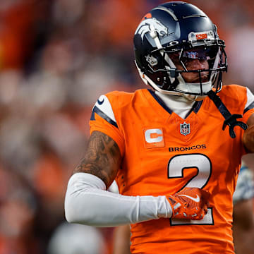 Dec 15, 2024; Denver, Colorado, USA; Denver Broncos cornerback Pat Surtain II (2) gestures after a play in the third quarter against the Indianapolis Colts at Empower Field at Mile High. 
