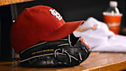 Aug 15, 2015; St. Louis, MO, USA; A detailed view of a baseball glove and St. Louis Cardinals hat in the dugout during the game between the Cardinals and the Miami Marlins at Busch Stadium. Mandatory Credit: Jasen Vinlove-Imagn Images