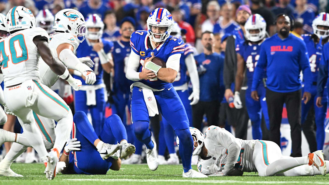 Sep 18, 2025; Orchard Park, New York, USA; Buffalo Bills quarterback Josh Allen (17) runs the ball against the Miami Dolphins.