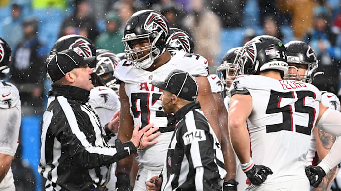 Dec 17, 2023; Charlotte, North Carolina, USA; The officials talk to Atlanta Falcons defensive tackle