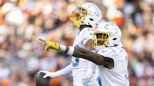 Chargers safety Derwin James Jr., right, celebrates with cornerback Tarheeb Still after his interception.