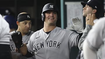 May 18, 2021; Arlington, Texas, USA; New York Yankees first baseman Mike Ford (36) celebrates with teamates after scoring during the fourth inning against the Texas Rangers at Globe Life Field. Mandatory Credit: Kevin Jairaj-Imagn Images