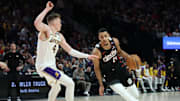 Portland Trail Blazers forward Kris Murray dribbles the ball past Los Angeles Lakers guard Dalton Knecht in the first half