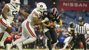 Dec 30, 2023; Nashville, TN, USA; Auburn Tigers defensive lineman Keldric Faulk (15) sacks Maryland Terrapins quarterback Cameron Edge (12) during the second half at Nissan Stadium. Mandatory Credit: Steve Roberts-Imagn Images