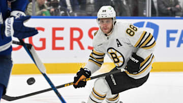 May 2, 2024; Toronto, Ontario, CAN;   Boston Bruins forward David Pastrnak (88) pursues the puck against the Toronto Maple Leafs in the second period in game six of the first round of the 2024 Stanley Cup Playoffs at Scotiabank Arena. Mandatory Credit: Dan Hamilton-Imagn Images