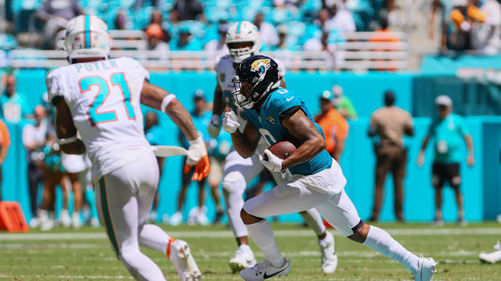 Sep 8, 2024; Miami Gardens, Florida, USA; Jacksonville Jaguars wide receiver Gabe Davis (0) runs with the football against the Miami Dolphins during the second quarter at Hard Rock Stadium. Mandatory Credit: Sam Navarro-Imagn Images