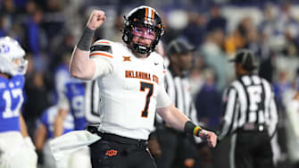 Oct 18, 2024; Provo, Utah, USA; Oklahoma State Cowboys quarterback Alan Bowman (7) celebrates a touchdown against the Brigham Young Cougars during the fourth quarter at LaVell Edwards Stadium. Mandatory Credit: Rob Gray-Imagn Images