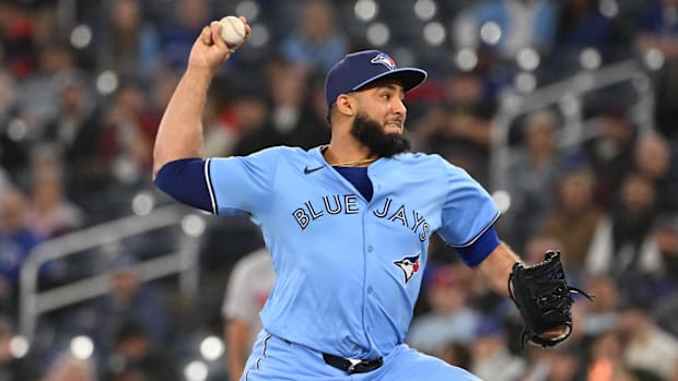 Toronto Blue Jays relief pitcher Yimi Garcia throws in a blue jersey and blue hat