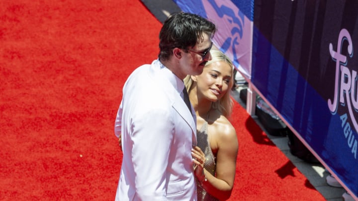 National League pitcher Paul Skenes of the Pittsburgh Pirates walks the red carpet with his girlfriend LSU gymnast Olivia Livvy Dunne before the 2024 MLB All-Star game at Globe Life Field.