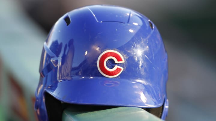 Sep 14, 2013; Pittsburgh, PA, USA; Chicago Cubs batting helmet sits on the dugout rail before the Cubs play the Pittsburgh Pirates at PNC Park.