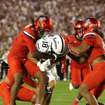 Sep 27, 2025; Ames, Iowa, USA; Iowa State Cyclones tight end Benjamin Brahmer (18) catches a pass in front of Arizona Wildcats defensive back Marquis Groves-Killebrew (5) during the first half at Jack Trice Stadium. Mandatory Credit: Reese Strickland-Imagn Images