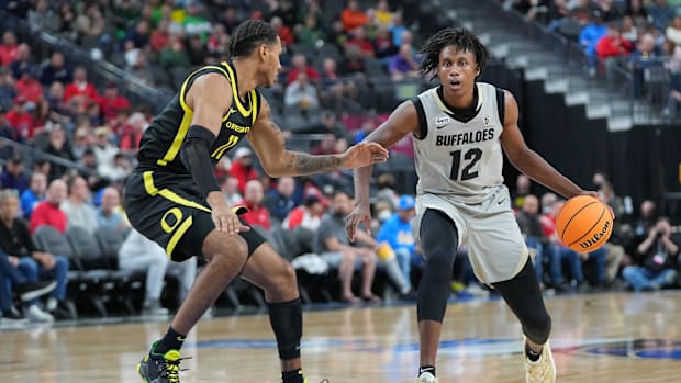 Mar 10, 2022; Las Vegas, NV, USA; Colorado Buffaloes forward Jabari Walker (12) dribbles against Oregon Ducks guard Rivaldo S