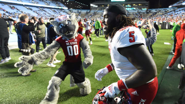 North Carolina State Wolfpack defensive tackle C.J. Clark (5) celebrates after the game at Kenan Memorial Stadium.