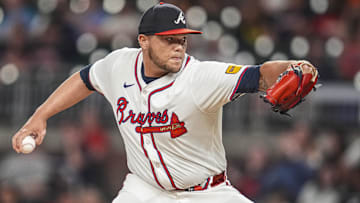 Sep 4, 2024; Cumberland, Georgia, USA; Atlanta Braves pitcher Joe Jimenez (77) pitches against the Colorado Rockies during the eighth inning at Truist Park. Mandatory Credit: Dale Zanine-Imagn Images