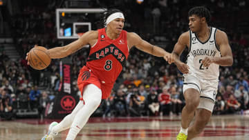 Nov 23, 2022; Toronto, Ontario, CAN; Toronto Raptors guard Ron Harper Jr. (8) drives to the net against \b25\during the second half at Scotiabank Arena. Mandatory Credit: John E. Sokolowski-USA TODAY Sports