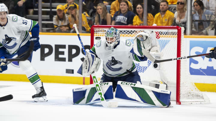 May 3, 2024; Nashville, Tennessee, USA; Vancouver Canucks goalkeeper Vancouver Canucks goalie Arturs Silovs (31) blocks the puck against the Nashville Predators during the third period in game six of the first round of the 2024 Stanley Cup Playoffs at Bridgestone Arena. Mandatory Credit: Steve Roberts-USA TODAY Sports