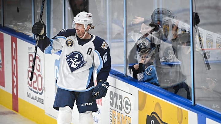 Milwaukee Admirals center Cal O'Reilly (16) celebrates his empty-net goal during the third period against the Texas Stars in a game Saturday, January 20, 2024, at the UW-Milwaukee Panther Arena in Milwaukee, Wisconsin.