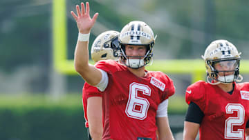 Jul 30, 2025; New Orleans, LA, USA;  New Orleans Saints quarterback Tyler Shough (6) waves to fans during training camp at Ochsner Sports Performance Center. Mandatory Credit: Stephen Lew-Imagn Images