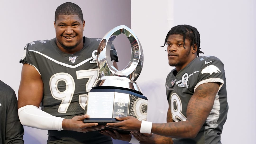 Jan 26, 2020; Orlando, Florida, USA; AFC defensive end Calais Campbell of the Jacksonville Jaguars and quarterback Lamar Jackson of the Baltimore Ravens (8) pose with trophy after the 2020 NFL Pro Bowl at Camping World Stadium. The AFC defeated the NFC 38-33.  Mandatory Credit: Kirby Lee-Imagn Images