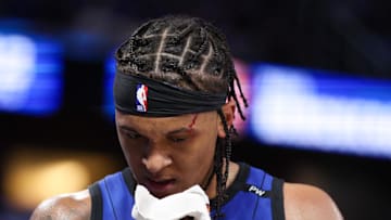 Orlando Magic forward Paolo Banchero (5) attends to a cut on his head against the Atlanta Hawks in the fourth quarter at Kia Center. 